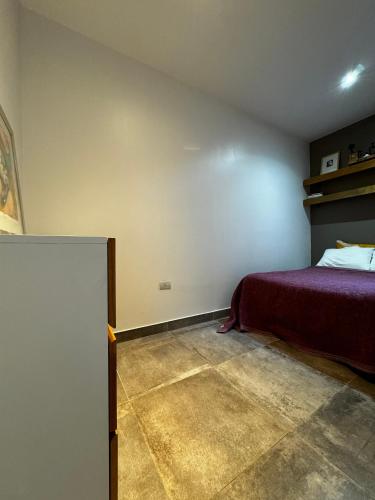 a bedroom with a bed in a room at Marcel de Buenos Aires in Buenos Aires