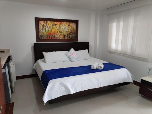 Postel nebo postele na pokoji v ubytování Hotel El Bosque Valledupar
