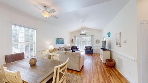 a living room with a table and a couch at Four Bedroom, Three Bath, Golf Villa, Scenic View in Pawleys Island