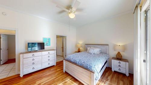 a bedroom with a bed and a ceiling fan at Four Bedroom, Three Bath, Golf Villa, Scenic View in Pawleys Island