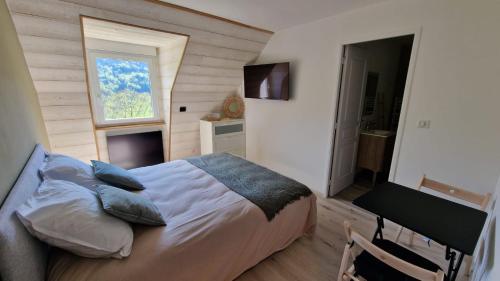 Ένα ή περισσότερα κρεβάτια σε δωμάτιο στο La Lys Martagon