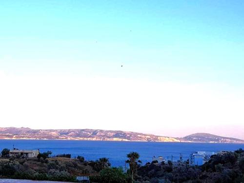 a view of the ocean from a hill at Creta Star Apartments in Agia Galini