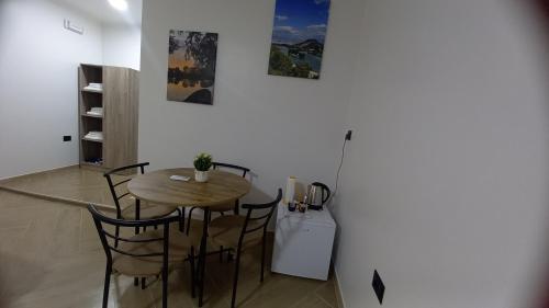 a dining room with a table and some candles at Three Brothers in Široka