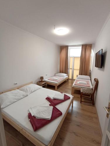 Postel nebo postele na pokoji v ubytování Euro Apartman