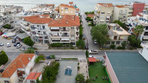 an aerial view of a city with houses and a tennis court at Ζ&Ζ Studios in Perea