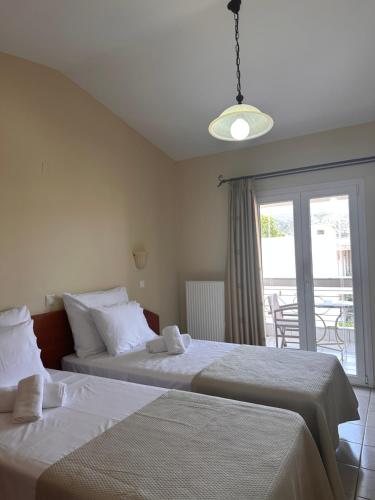 Letto o letti in una camera di HOTEL ARIADNI