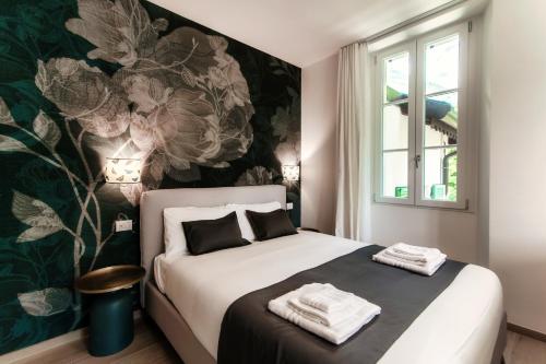 Una cama o camas en una habitación de Hotel Ristorante La Vignetta Cernobbio