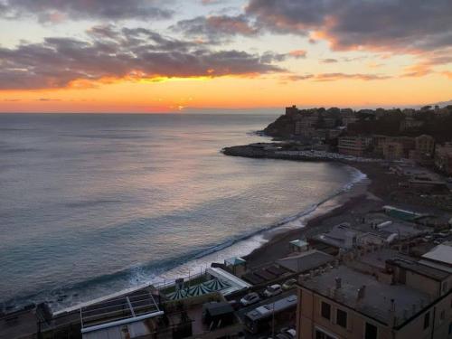 an aerial view of a beach at sunset at Gaslini Sea House in Genova