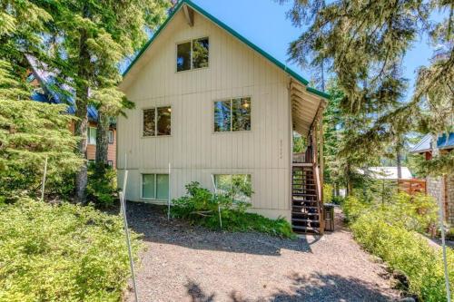 a house with a staircase in front of it at Sweet Cabin in Government Camp, Oregon in Government Camp