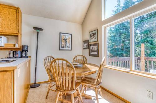 a kitchen with a table and chairs and a window at Sweet Cabin in Government Camp, Oregon in Government Camp