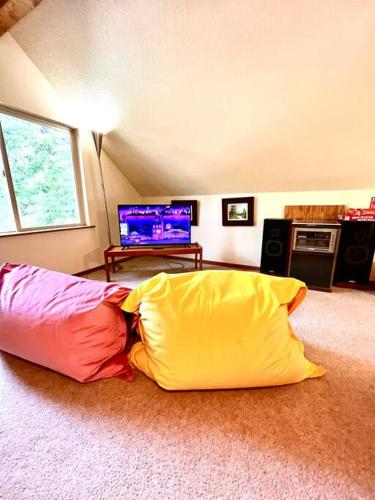 a room with two pillows sitting on the floor at Sweet Cabin in Government Camp, Oregon in Government Camp