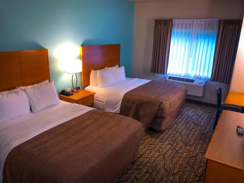 Postel nebo postele na pokoji v ubytování Aspen Hotel