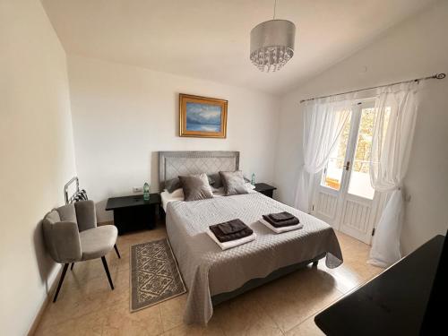 Postel nebo postele na pokoji v ubytování Villa Silmar