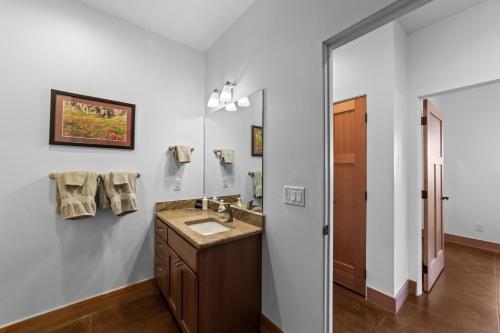 a bathroom with a sink and a mirror at 57 Robber's Roost in Moab