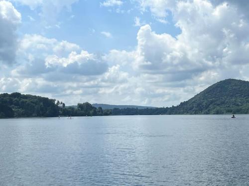 a large body of water with mountains in the background at Borgo del 1700- Le Scuderie- trilocale in Travedona