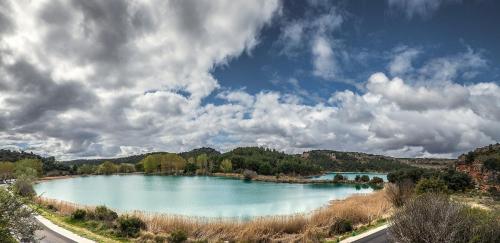 a large lake in the middle of a field at Villa Tranquila Lagunas de Ruidera in Ossa de Montiel