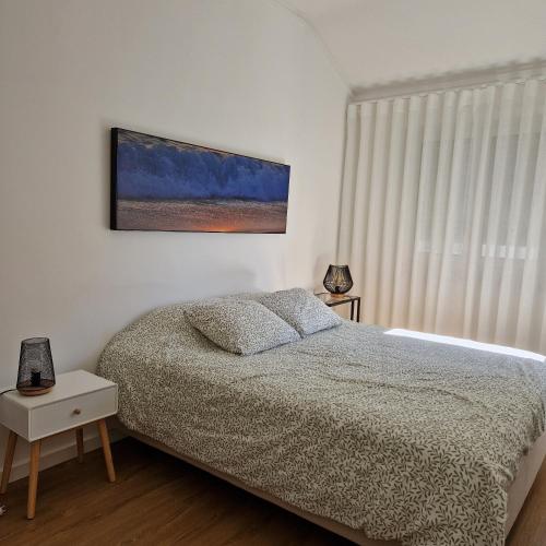 Ένα ή περισσότερα κρεβάτια σε δωμάτιο στο Junto à Praia