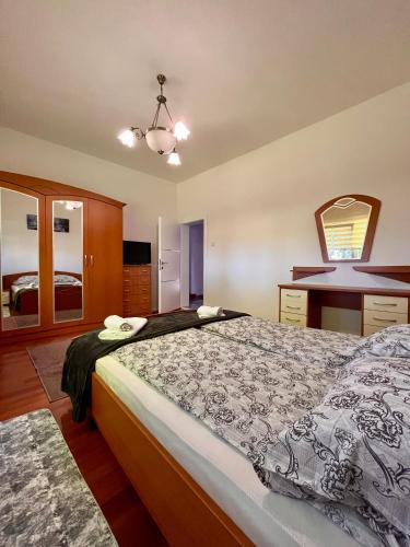 a bedroom with a large bed in a room at Villa Crystal in Bihać