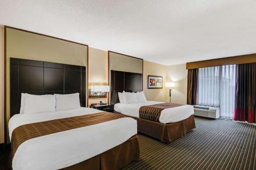 a hotel room with two beds and a window at Best Western Inn of Del Rio in Del Rio