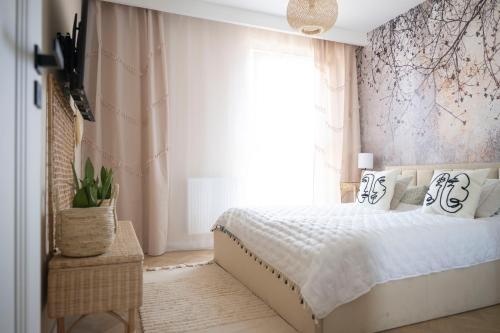 Postel nebo postele na pokoji v ubytování Apartamenty Deluxe