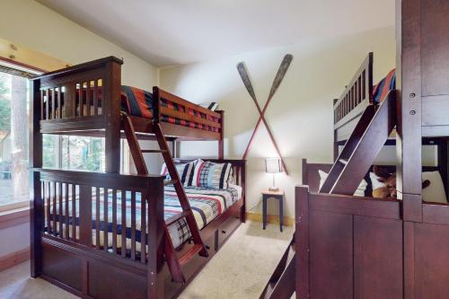 a room with two bunk beds and a bed at West Shore Retreat in Tahoma