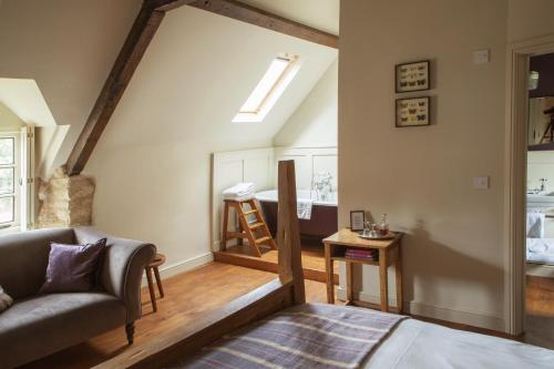 a living room with a couch and a skylight at Killingworth Castle in Woodstock