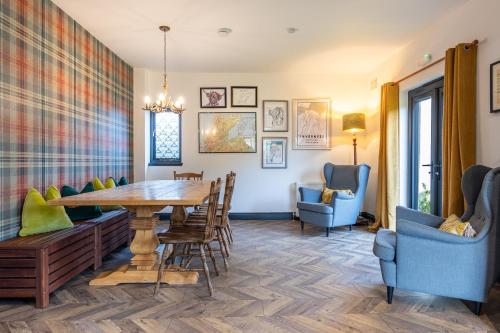 a dining room with a table and chairs at Ness on the Lane in Inverness
