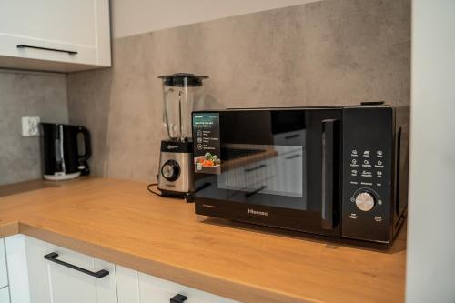 Kuchyň nebo kuchyňský kout v ubytování Apartamenty Deluxe