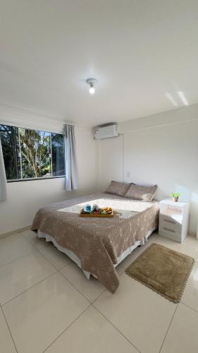 Katil atau katil-katil dalam bilik di Casa das Bromélias- 2 Quartos climatizados -Casa com Quiosque em meio à natureza!