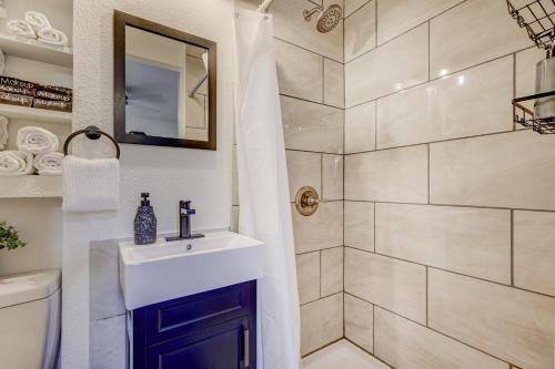 a bathroom with a sink and a shower at Hot Tub - Game Room - Wood Fireplace in Chipita Park