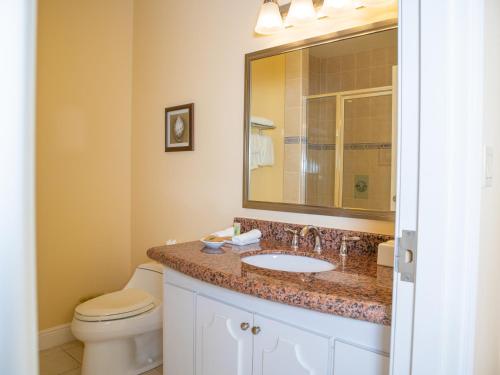 a bathroom with a sink and a toilet at Princess Vegas Hotel & Casino in Corozal