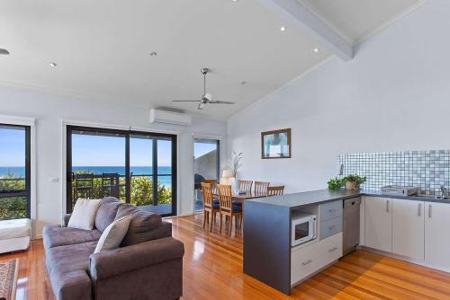 a kitchen and living room with a couch and a table at 4 Whitecrest Great Ocean Road Resort - Ocean View in Wongarra