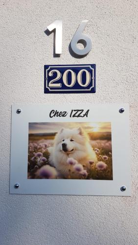 a sign on a wall with a polar bear on it at Chez IZZA Chambre au calme in Poulainville