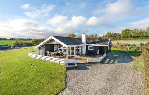 a home with a large yard with a house at Amazing Home In Nordborg With 3 Bedrooms, Sauna & Wifi in Nordborg