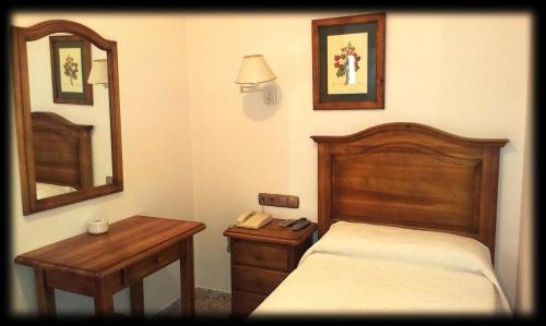 Postel nebo postele na pokoji v ubytování Hotel Bonilla