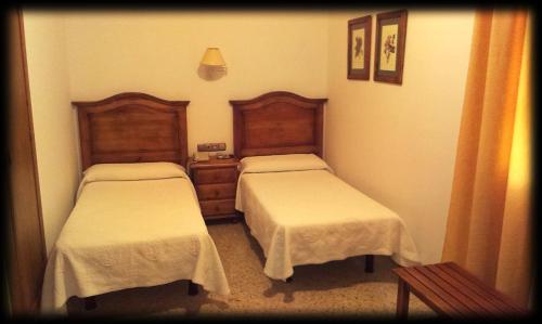 Postel nebo postele na pokoji v ubytování Hotel Bonilla