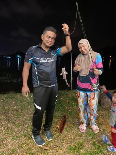 a man and a woman standing next to each other at Rajawali Riverside Retreat in Dungun