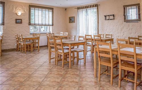 a dining room with wooden tables and chairs at 12 Bedroom Stunning Home In Debina in Debina
