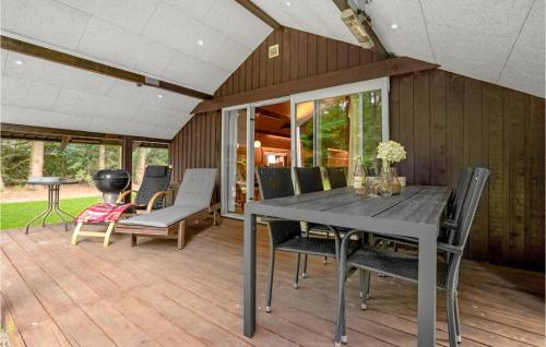 a dining room with a table and chairs at 4 Bedroom Beautiful Home In Toftlund in Toftlund