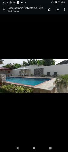 a screenshot of a picture of a swimming pool at Hotel villa J Leticia in Cereté