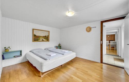 a white bedroom with a bed in a room at Lovely Apartment In Skjern With Wifi in Skjern