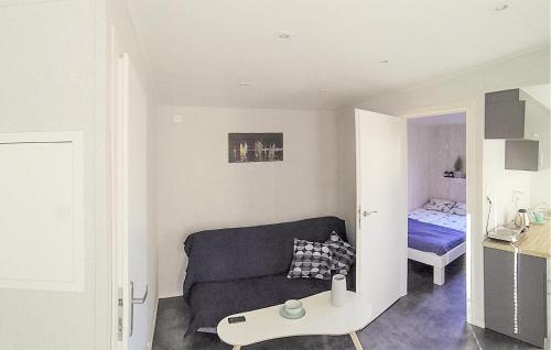 a living room with a couch and a bed at Lovely Home In Rewal With Wi-Fi in Rewal