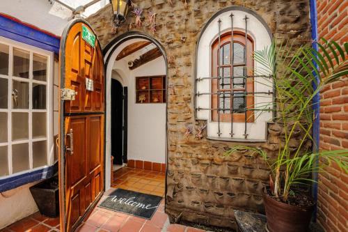 an entrance to a building with two arches and a door at Casa Aimée in Mexico City