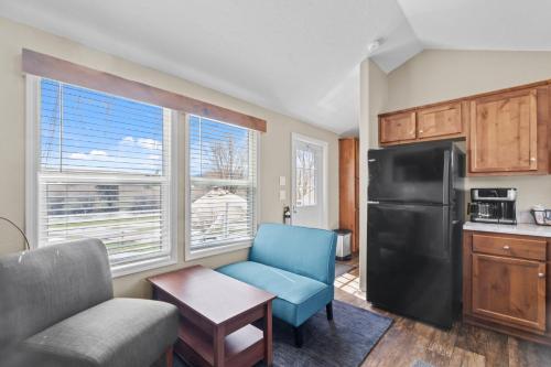 a kitchen with a blue chair and a refrigerator at Lost Trail in Lava Hot Springs