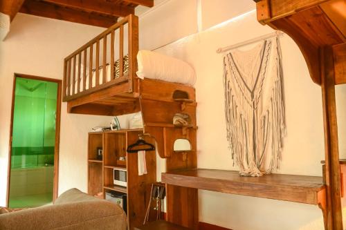 a living room with a loft bed and a staircase at Mesón De Leyendas Breakfast & Downtown in Valle de Bravo
