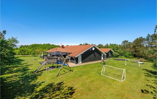 an aerial view of a house with a playground at Awesome Home In Løgstør With Sauna in Trend