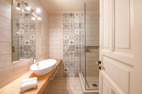 a bathroom with a sink and a shower at Teacher's House in Meganisi
