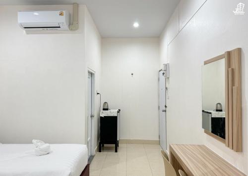 Postel nebo postele na pokoji v ubytování Jacky Chan Hotel
