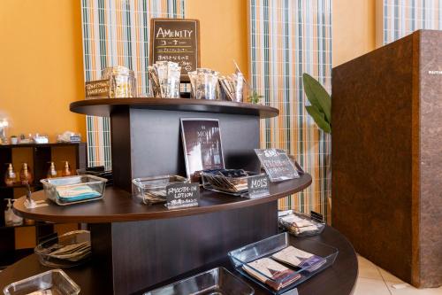 a table with some items on it in a room at HOTEL Villamure Ogori -ADULT ONLY- in Tosu