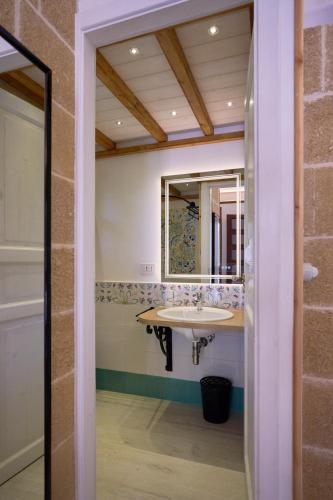 a bathroom with a sink and a mirror at B&B IreneMarchese Gluten Free in Taviano
